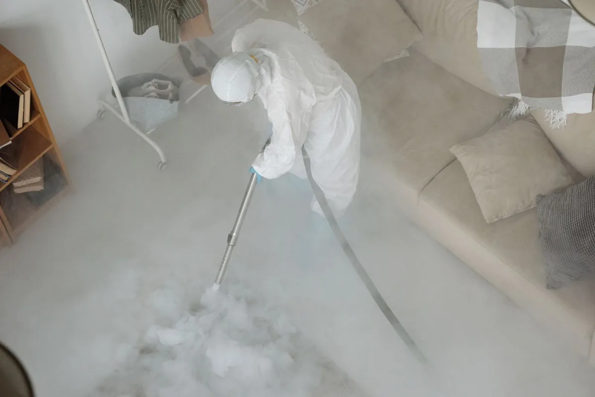 Biohazard cleanup technician in protective equipment, Pennsville, NJ